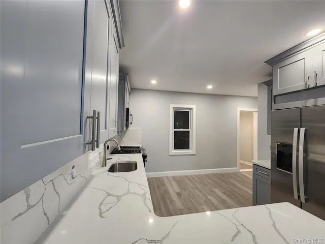 a bathroom with a sink and mirror