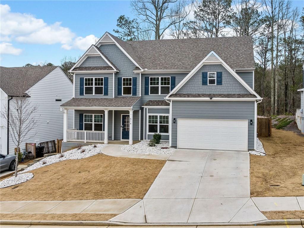 614 Edgemore Road Canton, GA 30114 - Photo 1 of 1 a front view of a house with yard and parking