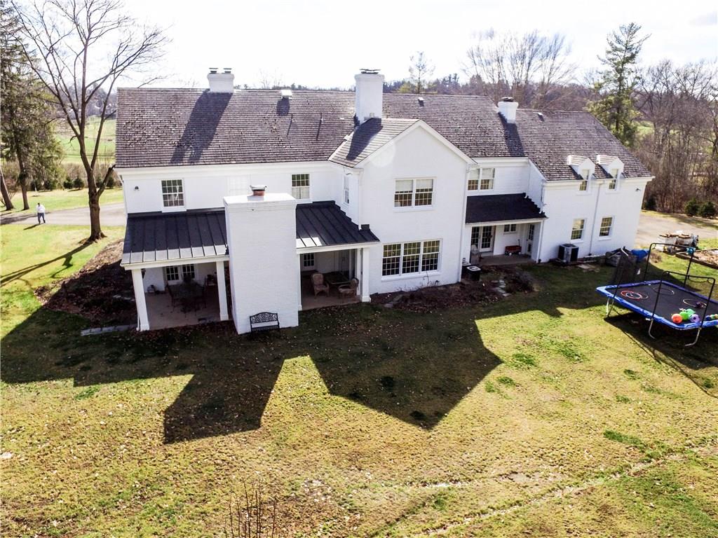 815 Fox Chapel Road Fox Chapel, PA 15238 - Photo 20 of 25 Room for a pool and great seating around it or tennis courts is no problem in this massive back yard area.
