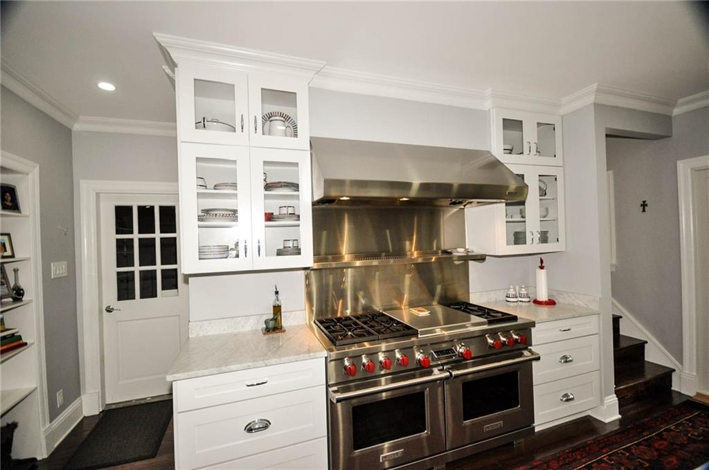 815 Fox Chapel Road Fox Chapel, PA 15238 - Photo 9 of 25 Many large cabinets surround the double gas range providing great storage for all your utensils and serving dishes.