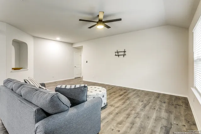 a living room with furniture and a couch