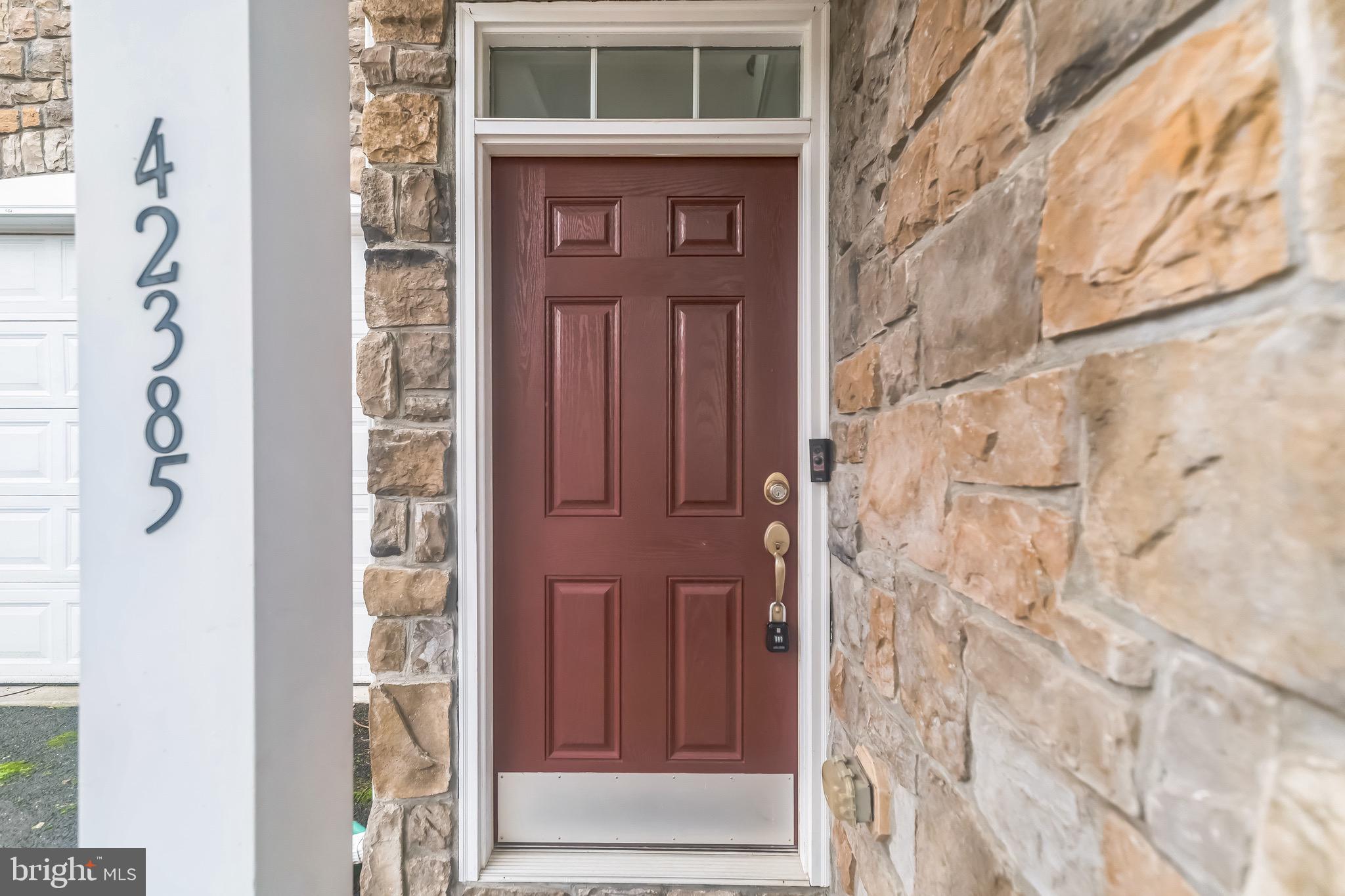 42385 Trellis Square Brambleton, VA 20148 - Photo 2 of 28 a door of a house with a door and a door