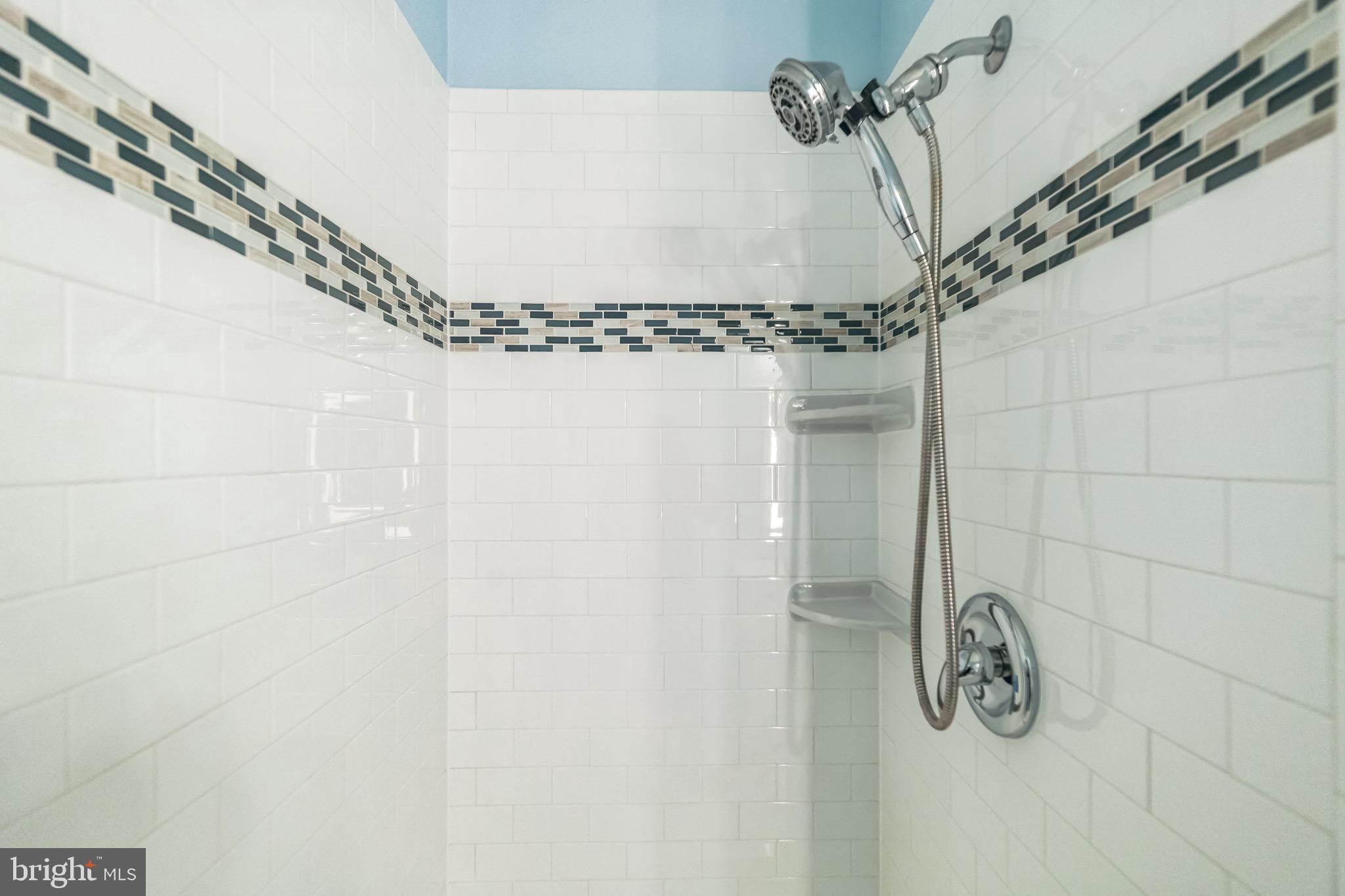 42385 Trellis Square Brambleton, VA 20148 - Photo 22 of 28 a bathroom with a shower