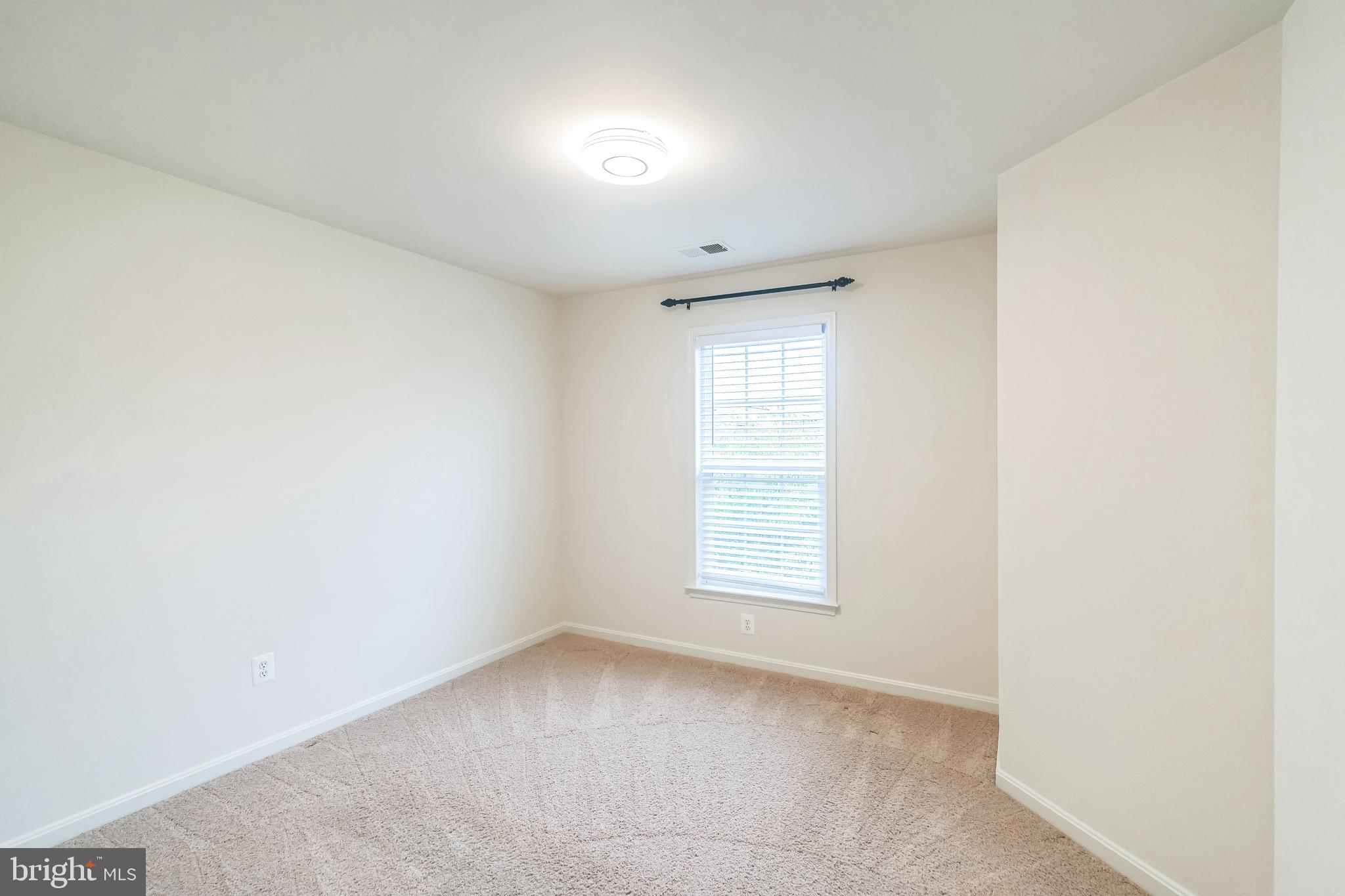 42385 Trellis Square Brambleton, VA 20148 - Photo 25 of 28 an empty room with a window