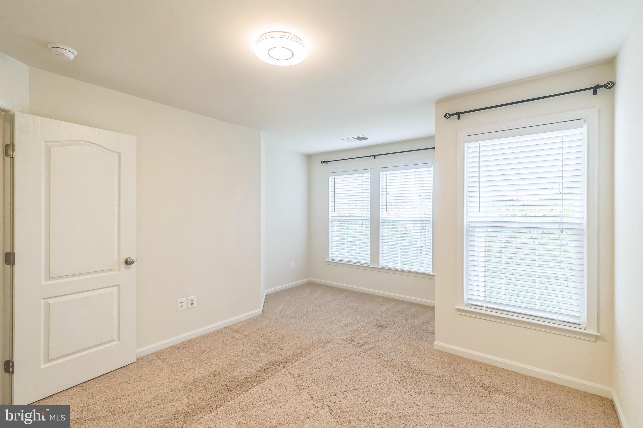 42385 Trellis Square Brambleton, VA 20148 - Photo 26 of 28 a view of an empty room with a window