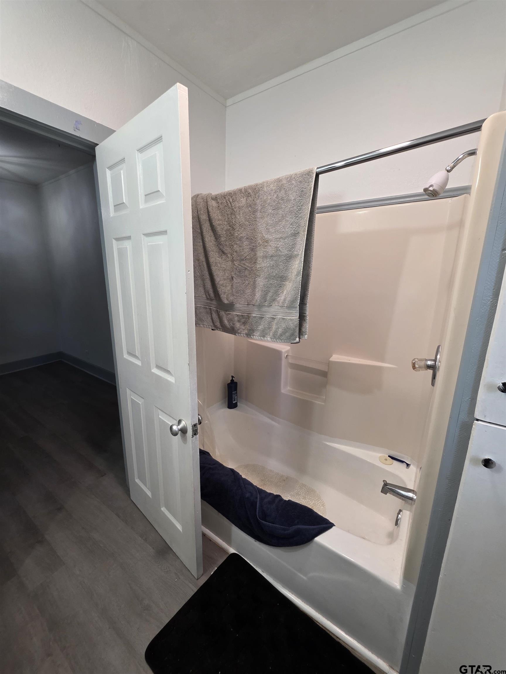 316 North Hospital Street Rusk, TX 75785 - Photo 16 of 21 a bathroom with a bathtub and a shower