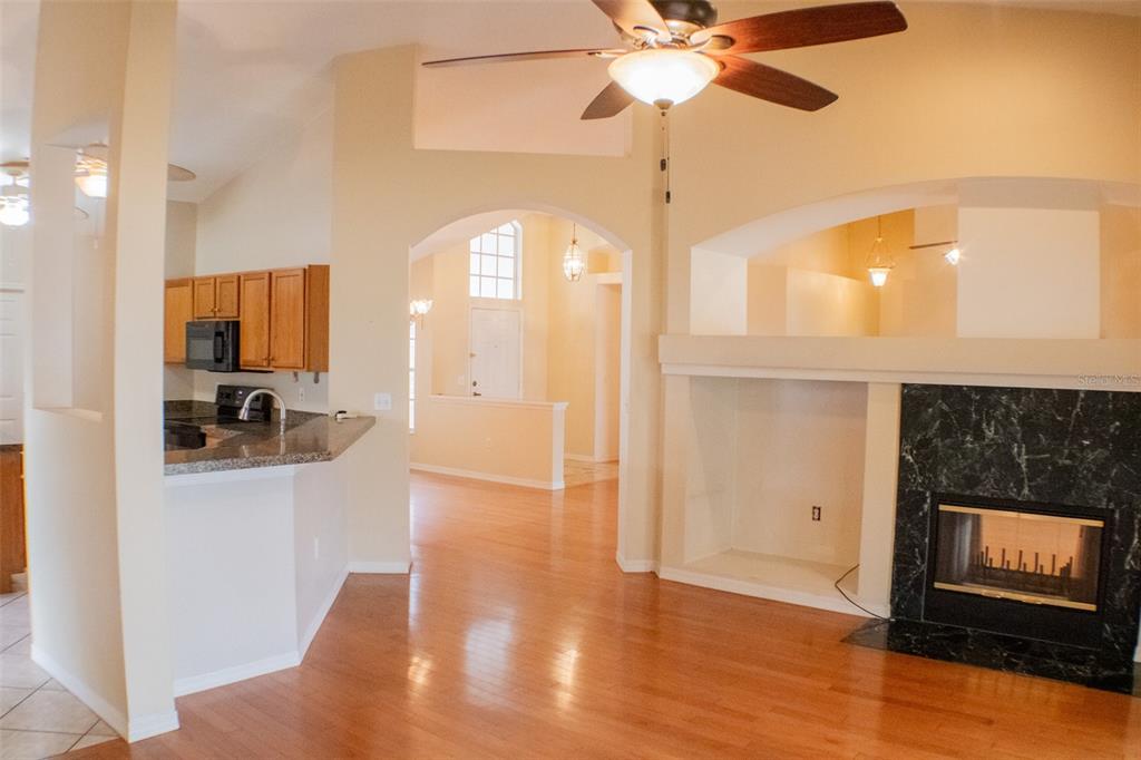 601 Shady Point Way Deland, FL 32724 - Photo 12 of 33 a view of a kitchen cabinets and a wooden floor
