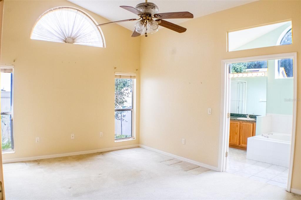 601 Shady Point Way Deland, FL 32724 - Photo 18 of 33 a view of an empty room with a window