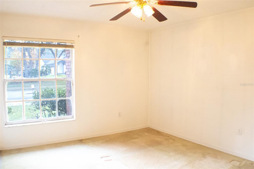 601 Shady Point Way Deland, FL 32724 - Photo 25 of 33 an empty room with a window