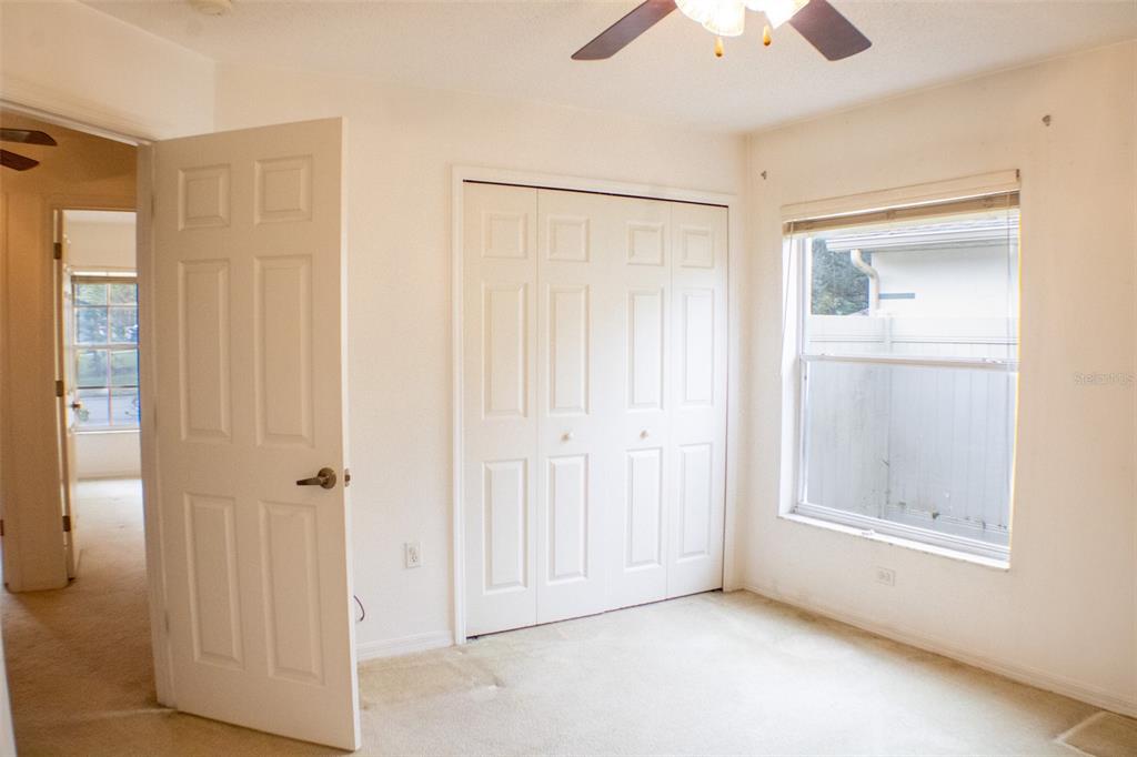 601 Shady Point Way DeLand, FL 32724 - Photo 27 of 36 a view of an empty room with closet and a window
