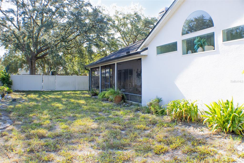 601 Shady Point Way Deland, FL 32724 - Photo 32 of 33 a backyard of a house with lots of green space