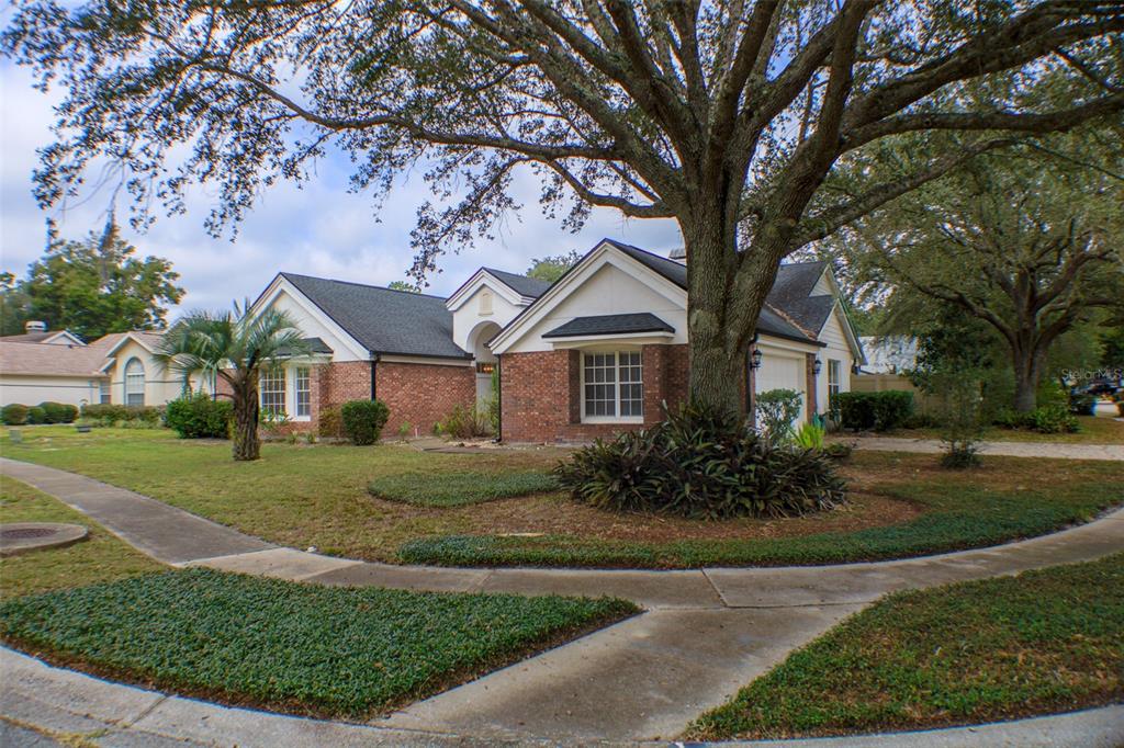 601 Shady Point Way DeLand, FL 32724 - Photo 36 of 36 a front view of a house with garden