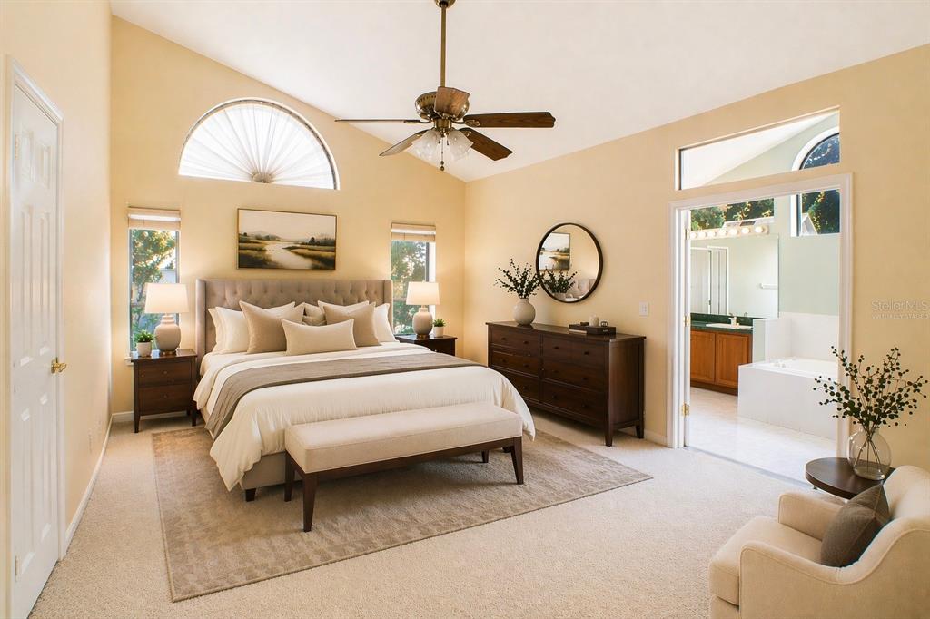 601 Shady Point Way DeLand, FL 32724 - Photo 5 of 36 a bedroom with a bed and a chandelier