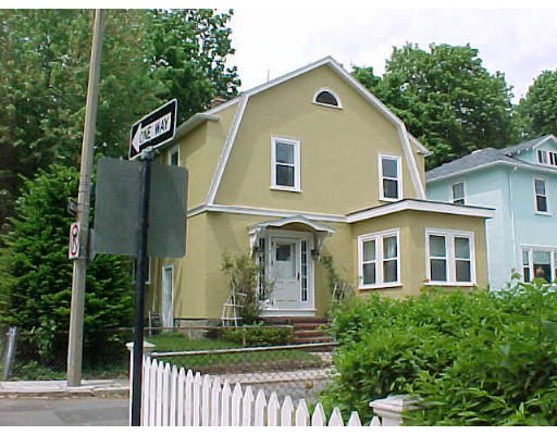 22 Garth Road Boston, MA 02132 - Photo 1 of 2 a front view of a house with a yard
