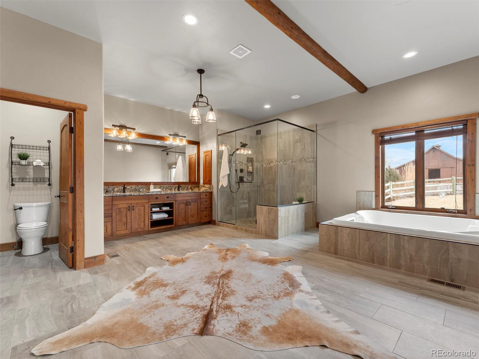 934 South Perry Park Road Sedalia, CO 80135 - Photo 26 of 48 a large room with a large window and furniture