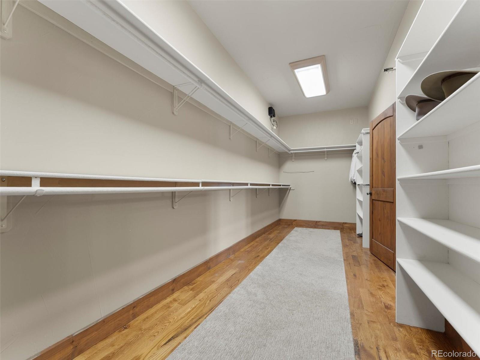 934 South Perry Park Road Sedalia, CO 80135 - Photo 28 of 48 a view of an empty walk in closet