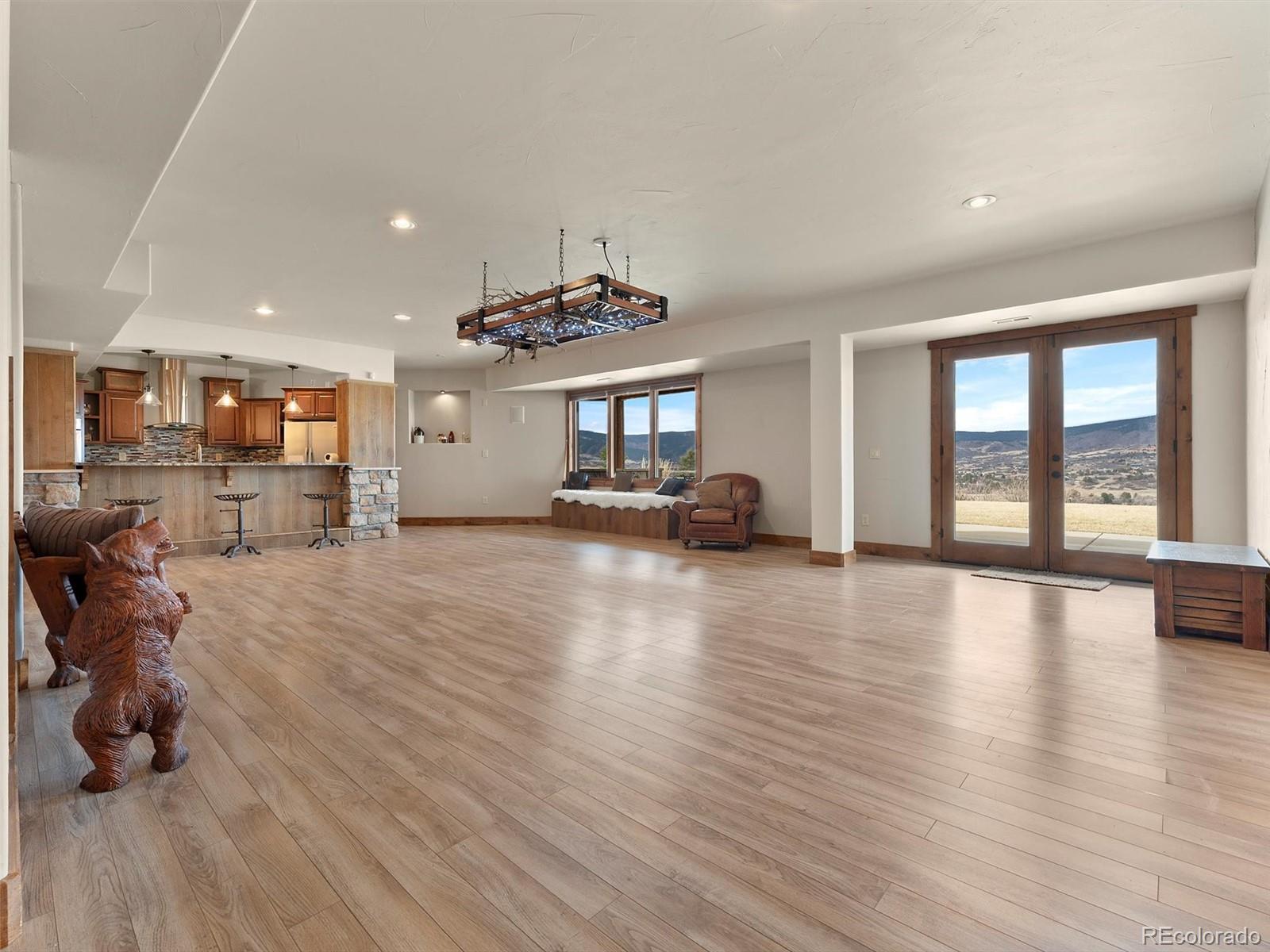 934 South Perry Park Road Sedalia, CO 80135 - Photo 36 of 48 a view of a livingroom with furniture wooden floor and windows
