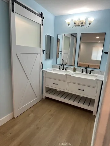 a bathroom with a double vanity sink mirror and double