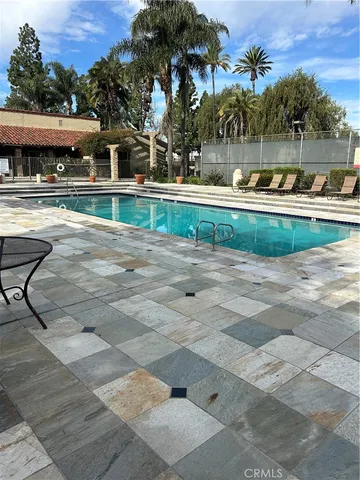 a view of a swimming pool with a patio