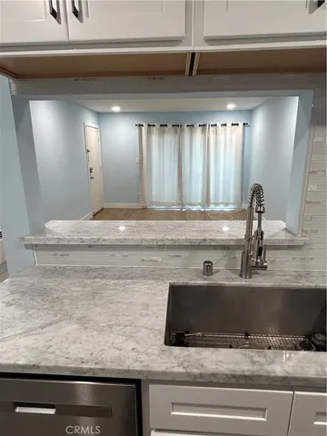 a bathroom with a sink and mirror
