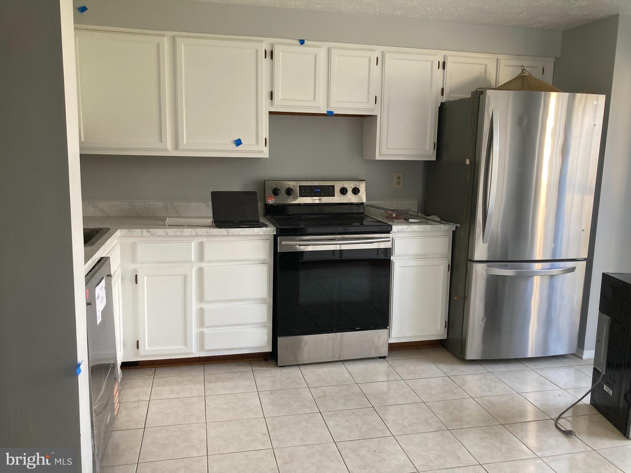 5012 Marlborough Terrace Upper Marlboro, MD 20772 - Photo 2 of 6 a kitchen with appliances cabinets and a window