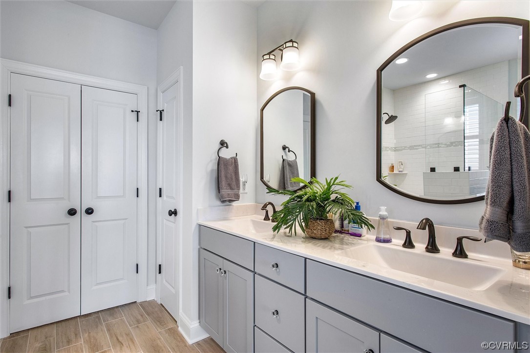 119 Evington Lane Ashland, VA 23005 - Photo 11 of 18 a bathroom with a double vanity sink and a mirror