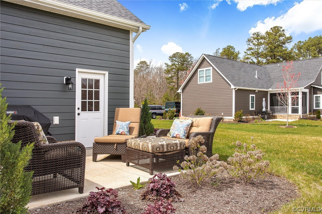 119 Evington Lane Ashland, VA 23005 - Photo 16 of 18 a view of a patio with couches chairs and a fire pit