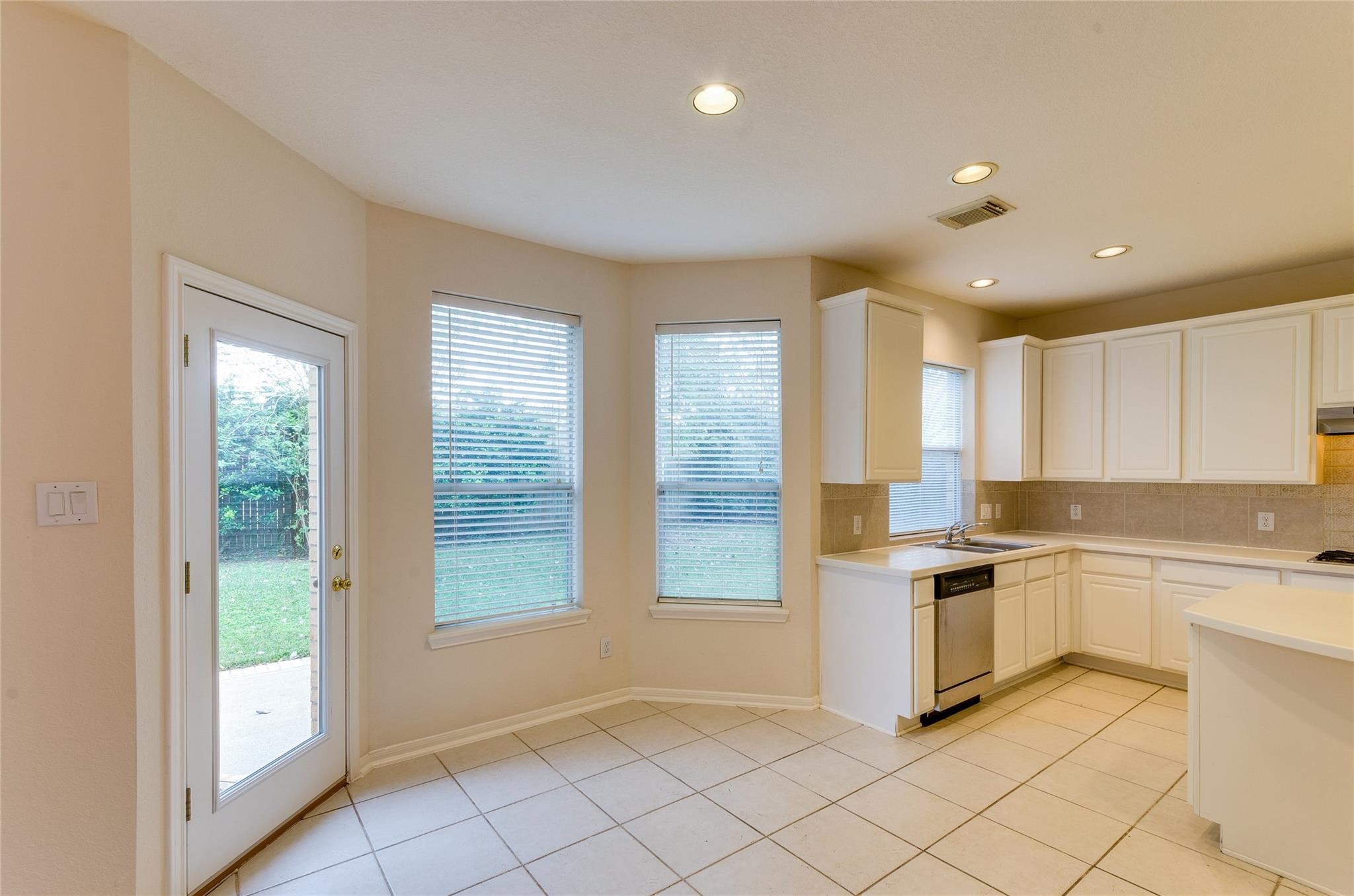 4019 Angel Spring Drive Sugar Land, TX 77479 - Photo 14 of 50 a kitchen with stainless steel appliances granite countertop a stove a sink and a refrigerator