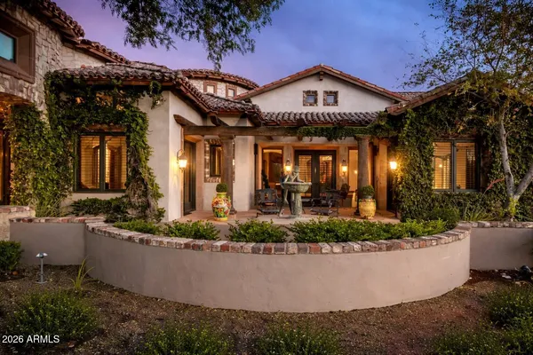 a bedroom with a bed couch and a window