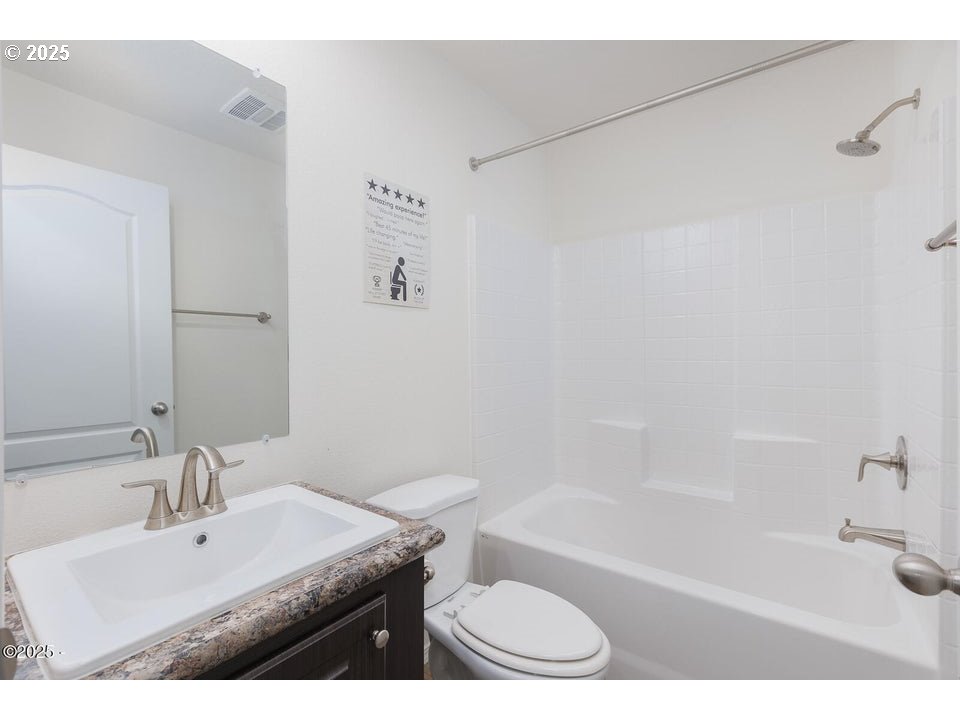150 Northwest 5th Street Toledo, OR 97391 - Photo 16 of 26 a bathroom with a sink a toilet and a bathtub