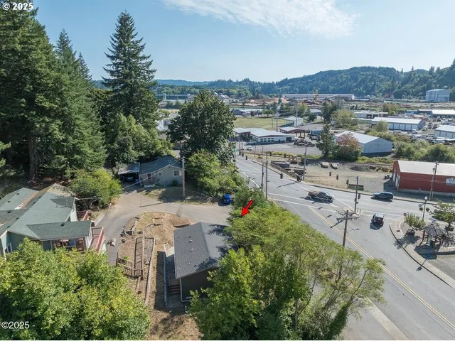 an aerial view of a house with outdoor space