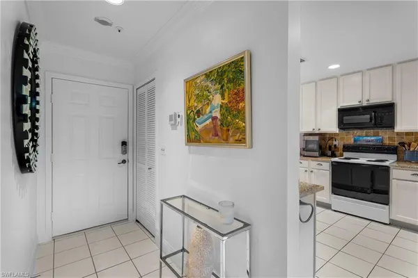 a kitchen with stainless steel appliances a stove a microwave and cabinets