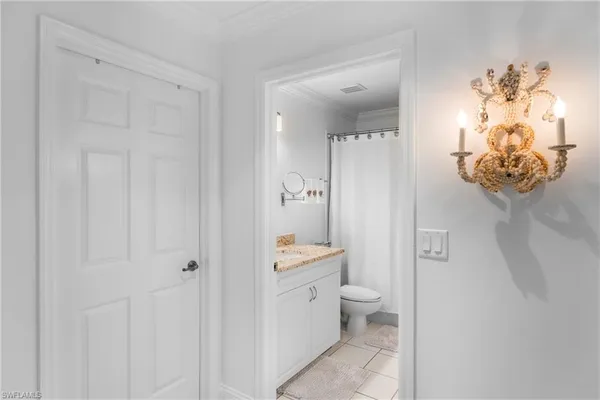 a spacious bathroom with a shower and a toilet