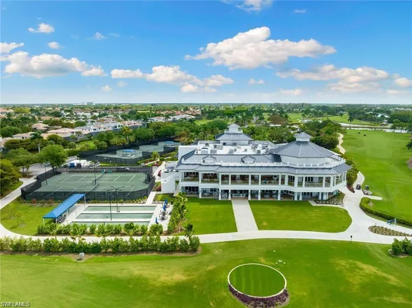 a view of a swimming pool with a house in the background