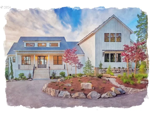 a front view of house with yard and trees in the background