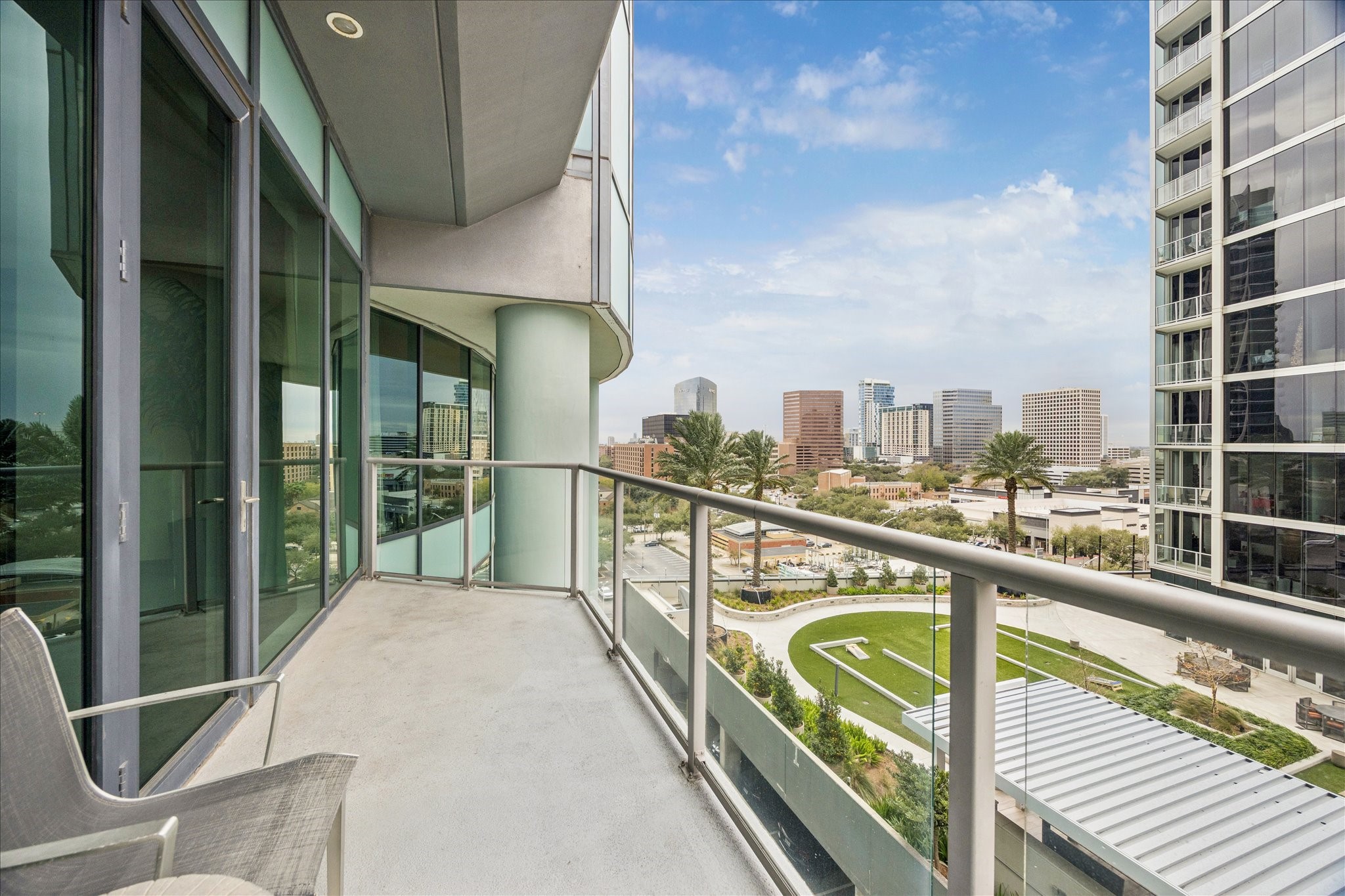 1600 Post Oak Boulevard, Unit 1007 Houston, TX 77056 - Photo 9 of 14 a view of a balcony with wooden floor