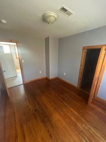 a view of a livingroom with wooden floor