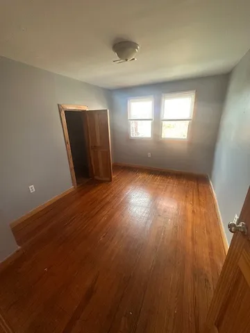 a kitchen with stainless steel appliances granite countertop a refrigerator a sink a stove a microwave and white cabinets