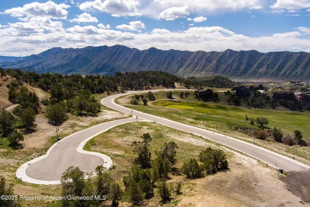 a view of a backyard with sitting area