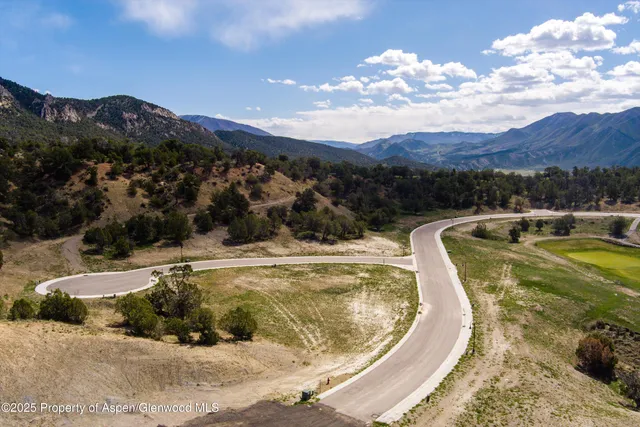 a view of a swimming pool with a yard