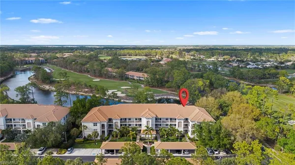an aerial view of a house with a lake view