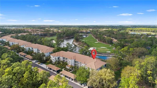 an aerial view of city and lake