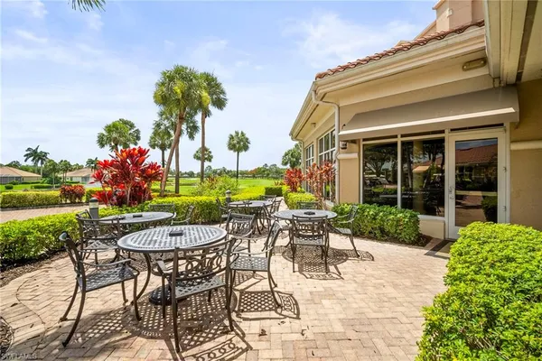 a view of a patio with a table and chairs
