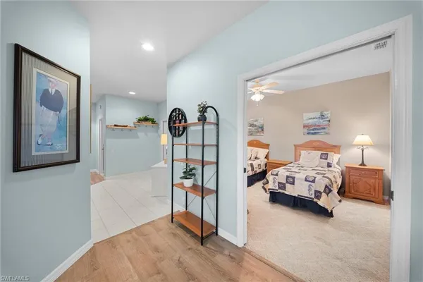 a bedroom with furniture and white walls