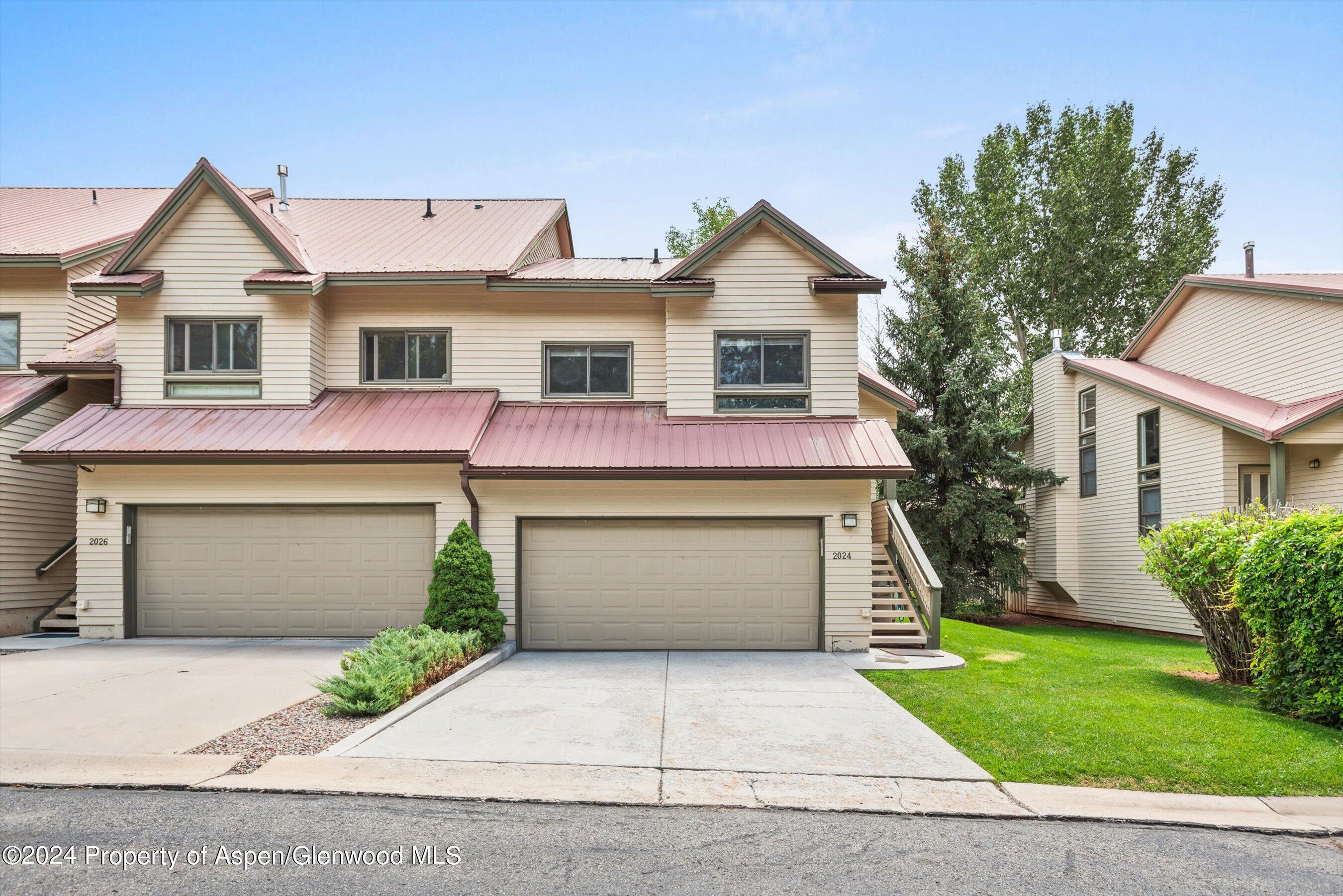 2024 Arbor Park Drive Basalt, CO 81621 - Photo 16 of 16 a front view of a house with a yard and garage