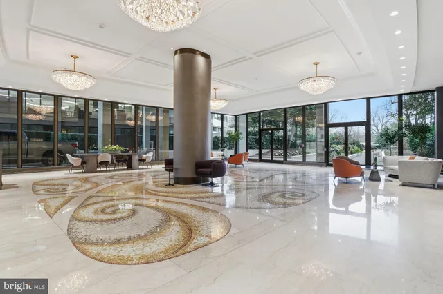 a view of swimming pool with a table and chairs