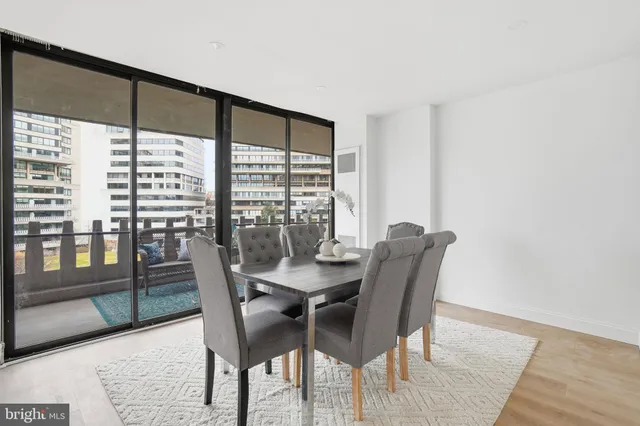 a view of a dining room with furniture window and wooden floor