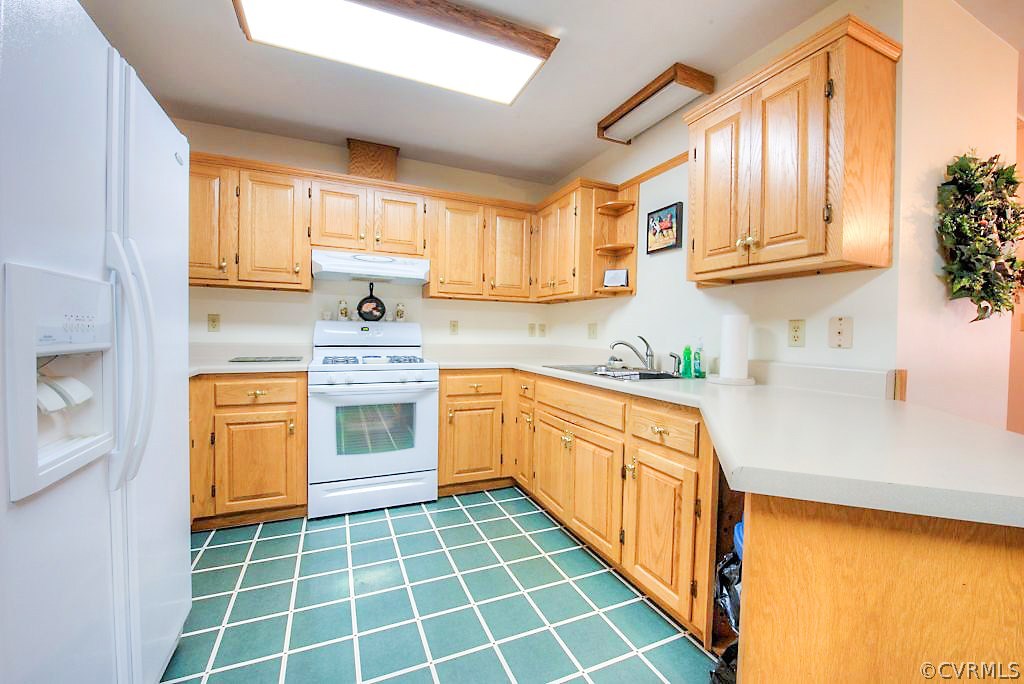 2923 Ashdale Road Center Cross, VA 22437 - Photo 11 of 45 Kitchen with wood cabinets, gas cooking, laminate