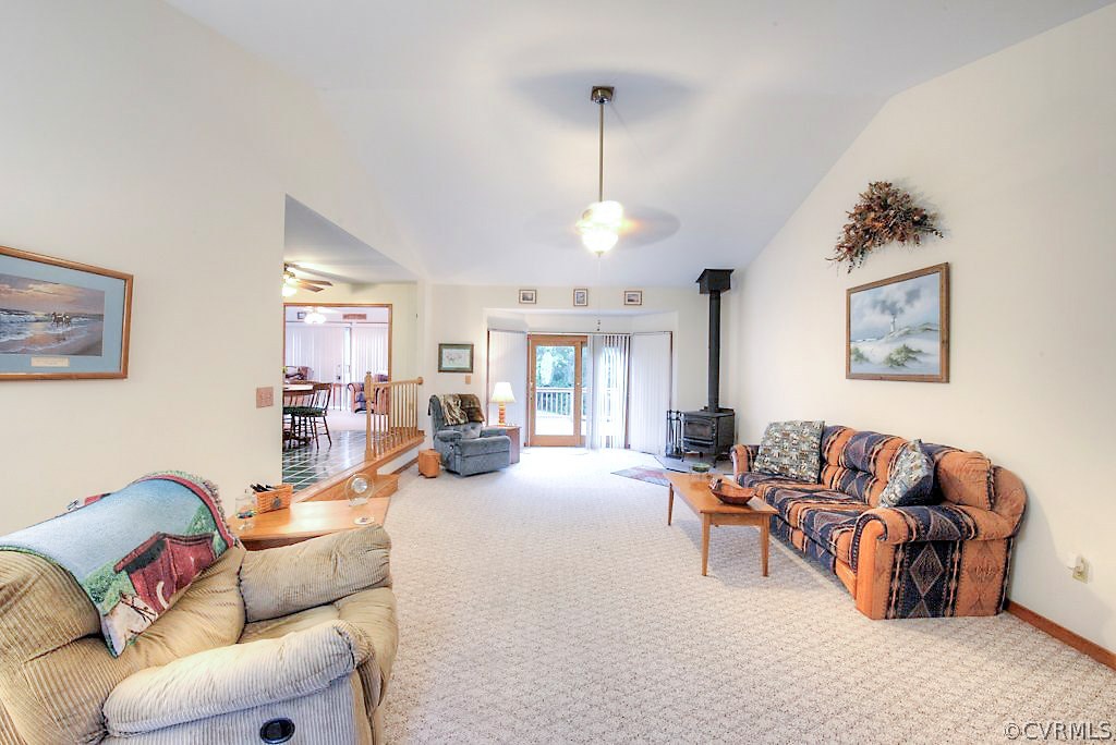 2923 Ashdale Road Center Cross, VA 22437 - Photo 4 of 45 Vaulted family room has carpet, fan/fixture, wood