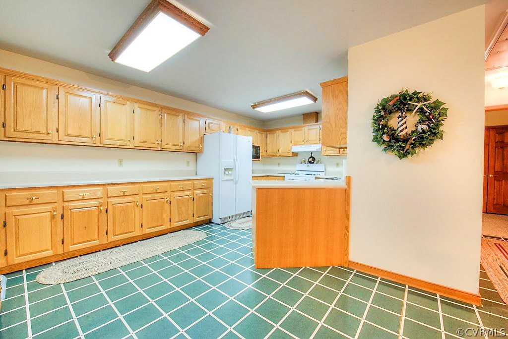2923 Ashdale Road Center Cross, VA 22437 - Photo 9 of 45 Kitchen with wood cabinets, gas cooking, laminate